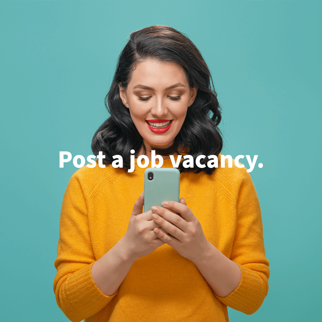 Woman holds phone in hand and smiles at it 'post a job vacancy' text on top of image